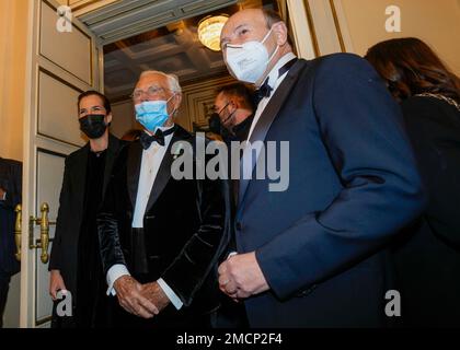 Fashion designer Giorgio Armani, center, is welcomed by La Scala Superintendent Dominique Meyer, right, as he arrives for the premiere of Verdi's Macbeth at La Scala opera house in Milan, Italy, Tuesday, Dec. 7, 2021. The Macbeth opens the 2021/2021 lyric season of one of the most storied opera house in the world. (AP Photo/Antonio Calanni)