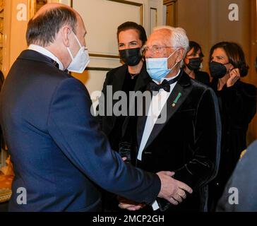 Fashion designer Giorgio Armani, right, is welcomed by La Scala Superintendent Dominique Meyer as he arrives for the premiere of Verdi's Macbeth at La Scala opera house in Milan, Italy, Tuesday, Dec. 7, 2021. The Macbeth opens the 2021/2021 lyric season of one of the most storied opera house in the world. (AP Photo/Antonio Calanni)