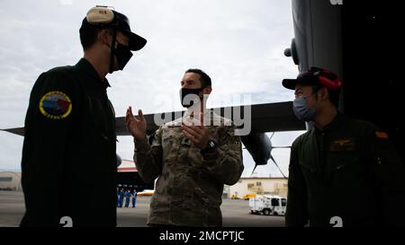 U.S. Air Force Lt. Col. Matthew Taylor, 1st Special Operations Squadron commander, greets members of the 71st Air Rescue Squadron in front of an MC-130J Commando II at Marine Corps Air Station Iwakuni, Japan, July 8, 2022. The Airmen of the 353rd Special Operations Wing work to uphold key relationships with Japanese partners and other allies. Stock Photo