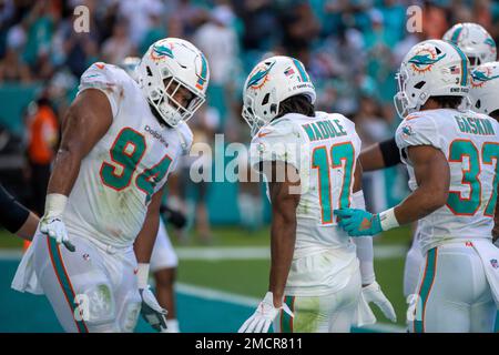 Miami Dolphins wide receiver Jaylen Waddle (17) goes flying as Buffalo Bills  defensive back Siran Neal (33) attempts a tackle, during the second half of  an NFL football game, Sunday, Sept. 19