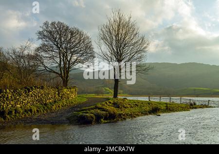 The outflow of water from Watendlath Tarn in the Lake District Stock Photo