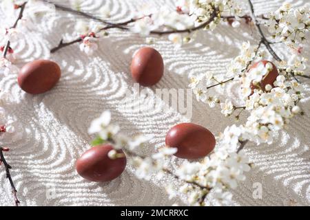 Colorful Easter eggs with spring blossom flowers. Colored Egg Holiday border. Easter cake Stock Photo