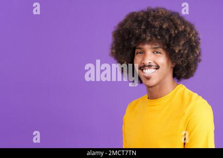 African man smiling while looking at camera Stock Photo