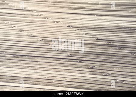 Blurred photo of a wooden boarded floor, abstract background or wallpaper. Stock Photo