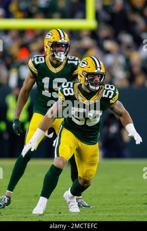 Green Bay Packers linebacker Isaiah McDuffie (58) picks up a loose ball  during an NFL football game against the Washington Commanders, Sunday, October  23, 2022 in Landover. (AP Photo/Daniel Kucin Jr Stock