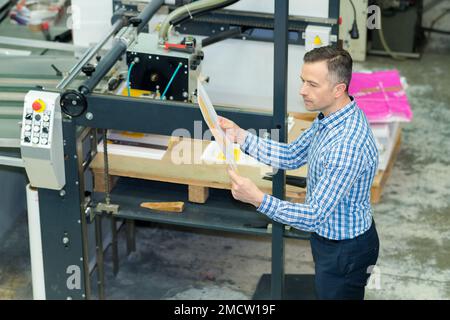 man in printing factory Stock Photo