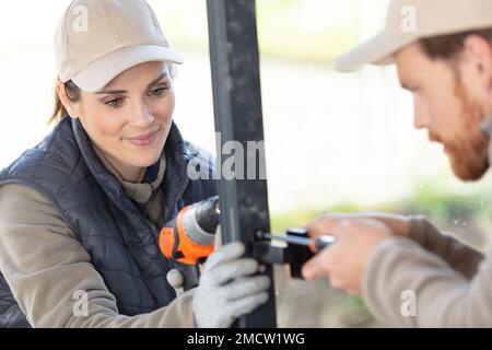construction team standing against building Stock Photo