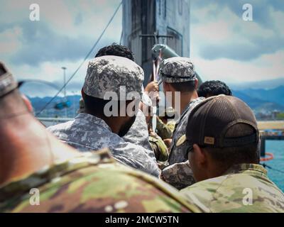 220710-N-EE352-1200 JOINT BASE PEARL HARBOR-HICKAM (July 10, 2022) – Multinational Special Operations Forces pull a combat rubber raiding craft topside aboard the Los Angeles-class attack submarine USS Charlotte (SSN 766) during Rim of the Pacific (RIMPAC) 2022, July 11. Twenty-six nations, 38 ships, four submarines, more than 170 aircraft and 25,000 personnel are participating in RIMPAC from June 29 to Aug. 4 in and around the Hawaiian Islands and Southern California. The world’s largest international maritime exercise, RIMPAC provides a unique training opportunity while fostering and sustain Stock Photo