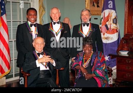 FILE - The Kennedy Center Honors recipients of 1993, are, founder of the Dance Theater of Harlem Arthur Mitchell, from left, entertainer Johnny Carson, composer-lyricist Stephen Sondheim; sitting from left, conductor Georg Solti and singer Marion Williams posing for a portrait wearing their medals following a dinner in their honor at the State Department in Washington, D.C., on Dec. 4, 1993. Sondheim, the songwriter who reshaped the American musical theater in the second half of the 20th century, has died at age 91. Sondheim's death was announced by his Texas-based attorney, Rick Pappas, who t