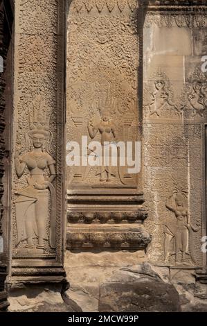 Carvings of trio of Apsaras on walls, Angkor Wat temple, Siem Riep, Cambodia Stock Photo