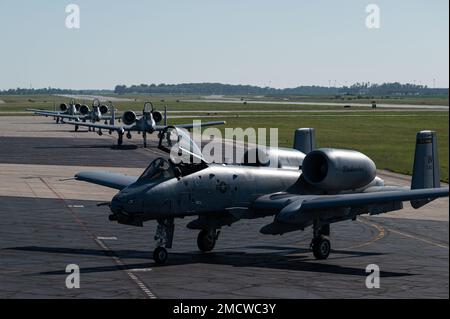 A-10C Thunderbolt II aircraft, assigned to the 122nd Fighter Wing, taxi in a formation collectively referred to by U.S. Air Force personnel as an 'elephant walk' while at the Fort Wayne Air National Guard Base, Indiana July 10, 2022. The term has been used widely since World War II to showcase a unit's capabilities and team working abilities. Stock Photo