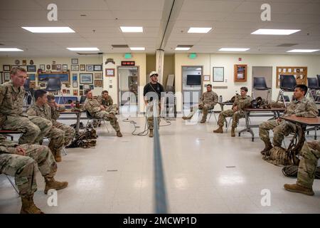 Staff Sgt. Jordan Weeg, mountaineering instructor at Northern Warfare Training Center, holds a class about advanced artificial protection anchors with 11th Airborne Division Soldiers indoors, due to inclement weather safety concerns during Advanced Military Mountaineering Course on Black Rapids Training Site 10 July. The purpose of the 14-day course is to train Soldiers on how to maneuver through mountainous terrain, and then go back to their units and provide the units with Soldiers capable to get across the mountainous terrain of Alaska. (Photo provided by Staff Sgt. Christopher Dennis/ 11th Stock Photo