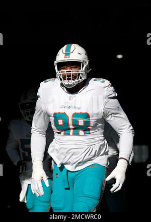 Miami Dolphins defensive tackle Raekwon Davis (98) walks on the