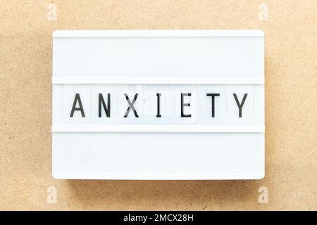 Lightbox with word anxiety on wood background Stock Photo
