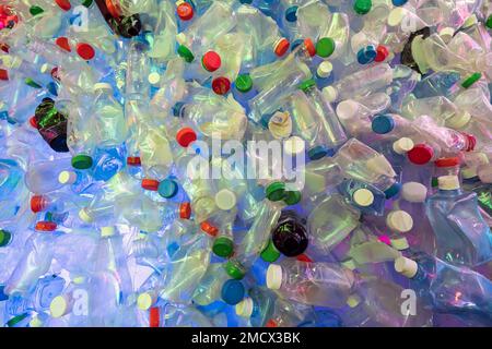 multicolored background of plastic bottles. The problem of plastic pollution of the planet. Stock Photo