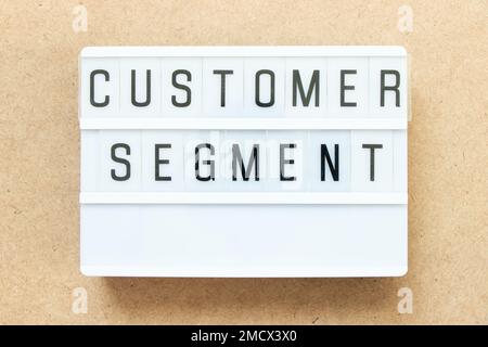 Lightbox with word customer segment on wood background Stock Photo