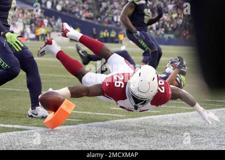 Arizona Cardinals running back Eno Benjamin (26) dives for the end zone  against the Seattle Seahawks during the second half of an NFL football  game, Sunday, Nov. 21, 2021, in Seattle. Benjamin