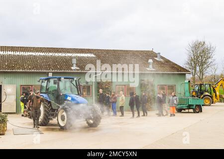 Aarhus, Denmark - November 16, 2022: Cleaning tractors at farm school in Aarhus in Denmark Stock Photo