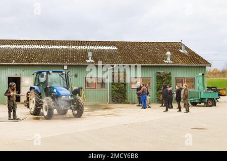 Aarhus, Denmark - November 16, 2022: Cleaning tractors at farm school in Aarhus in Denmark Stock Photo