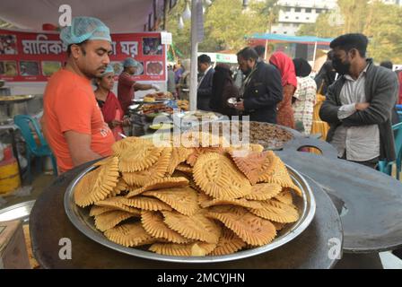 Dhaka. 22nd Jan, 2023. This photo taken on Jan. 21, 2023 shows a type of Pitha for sale at a stall during a Pitha festival in Dhaka, Bangladesh on Jan. 21, 2023. During winter, people in many parts of Bangladesh eat various kinds of Pitha, a general name for local handmade winter pastries. Credit: Xinhua/Alamy Live News Stock Photo