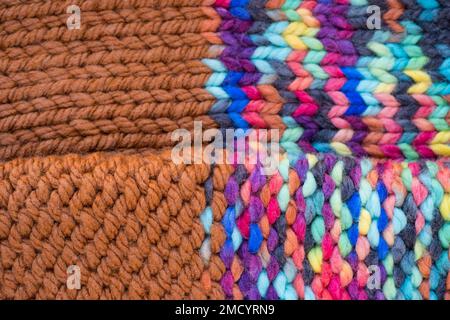 Pattern fabric made of wool. Handmade knitted fabric, color and brown wool background texture. Textured surface, back or wrong side. Warm accessories, Stock Photo