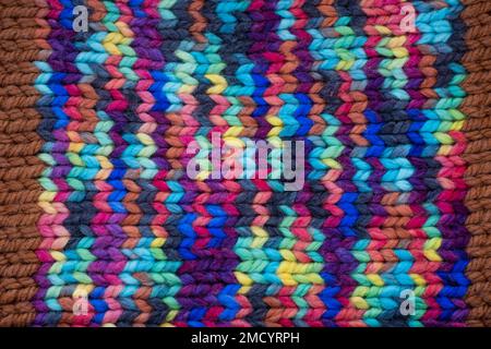 Pattern fabric made of wool. Handmade knitted fabric, color wool background texture. Warm accessories, clothing Stock Photo