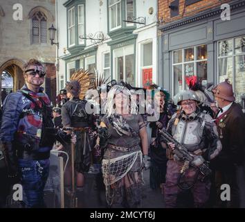 A large group of steampunks dressed in retro futuristic clothing. Stock Photo
