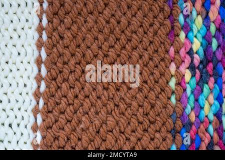 Pattern fabric made of wool. Handmade knitted fabric, white and brown wool background texture. Textured surface, back or wrong side. Warm accessories, Stock Photo
