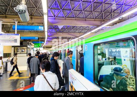 Tokyo Hamamatsucho station interior. People boarding Tokyo monorail train at the platform about to depart for Haneda International Airport. Stock Photo