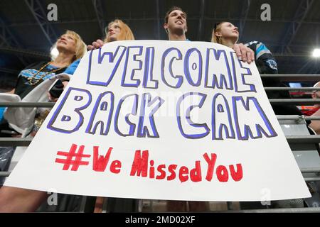 Welcoming back Carolina Panthers quarterback Cam Newton a Panthers fan  holds up a sign prior to an NFL football game against the Arizona Cardinals  Sunday, Nov. 14, 2021, in Glendale, Ariz. The