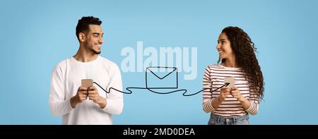 Smiling Arab Man And Woman Holding Smartphones Connected With Envelope Shape String Stock Photo