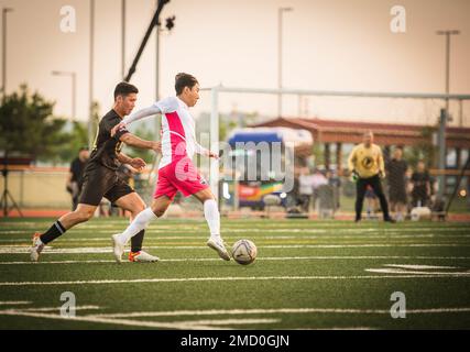 U.S. Army Capt. Sam Jang competes against South Korean Lee Chun-Soo, 2002 Olympic World Cup Soccer player, on USAG Humphreys middle school field, July 11, 2022. The event was held to strengthen comradery and friendship between the United States military and South Korea. Stock Photo