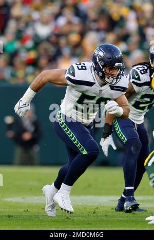 Seattle Seahawks linebacker Jon Rhattigan (59) runs with the 12 flag before  an NFL football game against the Tennessee Titans, Sunday, Sept. 19, 2021,  in Seattle. (AP Photo/Elaine Thompson Stock Photo - Alamy