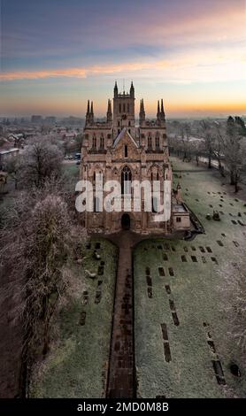 An aerial view of the North Yorkshire market town of Selby with the ancient architecture of Selby Abbey at sunrise on cold Winter morning Stock Photo