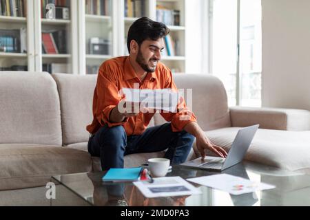 Handsome middle eastern man financial director working from home Stock Photo