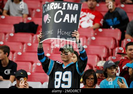 Welcoming back Carolina Panthers quarterback Cam Newton a Panthers fan  holds up a sign prior to an NFL football game against the Arizona Cardinals  Sunday, Nov. 14, 2021, in Glendale, Ariz. The