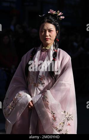 A woman of Chinese origin dressed in a traditional costume during the Chinese New Year parade celebration in Madrid. With more than 4,000 years of antiquity, it is the most important festivity of the Asian country and this year the protagonist will be the rabbit, an animal that represents peace, kindness and hope. China celebrates its New Year by following its own horoscope, which is governed by the phases of the moon, not the Gregorian calendar, so the yearly start date changes. The epicenter is the Usera district, which brings together the largest Chinese community in Madrid. (Photo by Atila Stock Photo