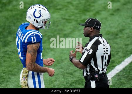 Referee Brad Rogers, left stands with replay official Durwood Manley before  an NFL football game between the Los Angeles Rams and the Las Vegas Raiders,  Thursday, Dec. 8, 2022, in Inglewood, Calif. (