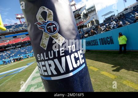 An Indianapolis Colts player warms up by a Salute to Service military  appreciation logo before an NFL football game against the Tennessee Titans  Thursday, Nov. 12, 2020, in Nashville, Tenn. (AP Photo/Ben