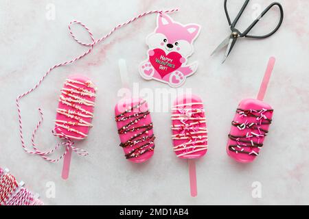 A homemade cakesicle decorated with edible bees in a bowl full of sprinkles  Stock Photo - Alamy