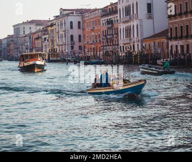 October 31, 2022 - Venice, Italy: People on a boat in the canal of Venice. Tourism concept. Stock Photo