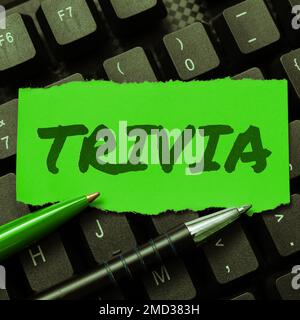 Hand writing sign Trivia. Concept meaning details considerations pieces information little importance or value Stock Photo