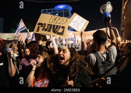Tel Aviv, Israel. 21st Jan, 2023. Protesters chant slogans while holding placards during the demonstration. Over 100,000 people protested in Tel Aviv against Netanyahu's far-right government and judicial overhaul. (Photo by Matan Golan/SOPA Images/Sipa USA) Credit: Sipa USA/Alamy Live News Stock Photo