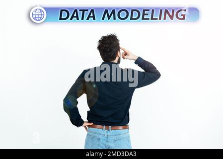 Text caption presenting Data Modeling. Business overview process of transferring data between data storage systems Stock Photo