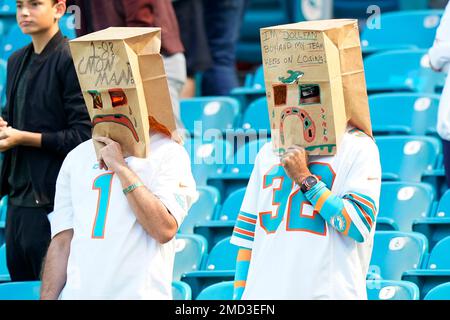 Miami Dolphins fans wear paper bags on their heads before an NFL