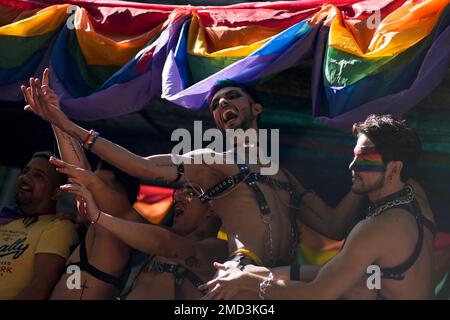 People dance during the annual Pride parade in Buenos Aires, Argentina, Saturday, Nov. 6, 2021. (AP Photo/Natacha Pisarenko)