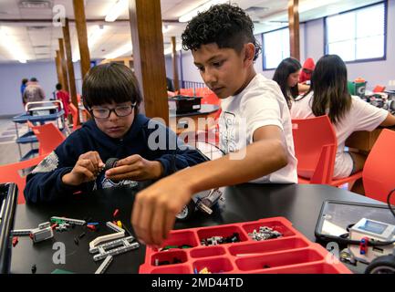 Students attending the STARBASE BattleBot camp assemble Lego pieces and other hardware to build their robots during the three-day camp held July 12-14, 2022 at Camp Umatilla, Oregon. The Department of Defense's STARBASE program provides underserved students in the U.S. an opportunity to explore science, technology, engineering, and mathematics in a stimulating community based outreach program. (National Guard photo by John Hughel, Oregon Military Department Public Affairs) Air National Guard,Army National Guard,Department of Defense,Oregon National Guard,STEM education,Starbase, Stock Photo