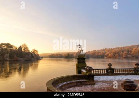 sunrise over frosty view of Trentham Lake and gardens with wire sculpture fairy by Robin Wright at Trentham Gardens and lake Stoke on Trent staffs Stock Photo