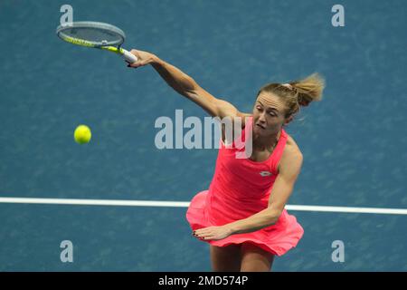 Iryna Shymanovich of Belarus returns a ball to Belgium's Elise Mertens