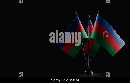 Small national flags of the Azerbaijan on a black background. Stock Photo